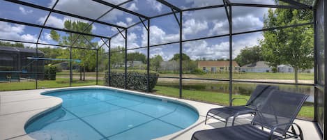 Private swimming pool overlooking pond area