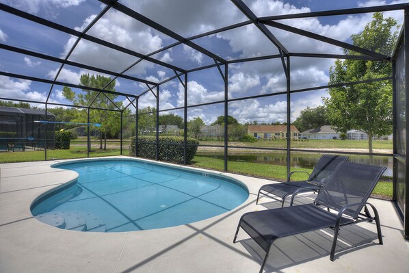 Private swimming pool overlooking pond area