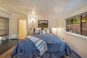 Primary bedroom with spacious king bed and closet