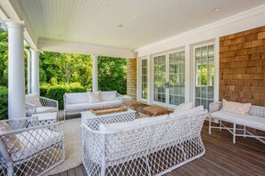 Outdoor seating area on covered porch