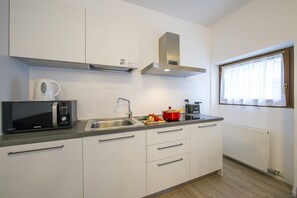 The bright kitchen is also equipped with a microwave