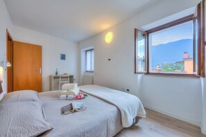 The master bedroom with large window overlooking the mountains