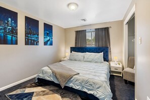 Master Bedroom w/ King Bed and Room Darkening Shades.