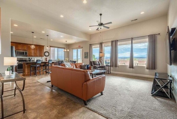 The open floor plan enhances the ambiance. From the Kitchen & Dining Area all the way to the Living Room, guests are invited to gather and enjoy relaxation and connection.