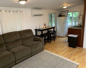 Comfortable couch, Very cool Split AC system, half kitchen, dining area