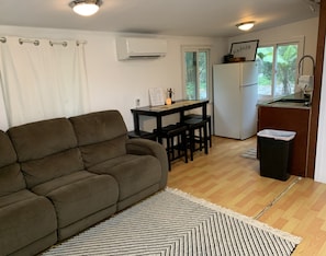Comfortable couch, Very cool Split AC system, half kitchen, dining area