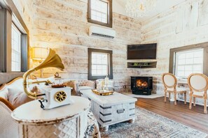 Living room with smart tv and propane fireplace