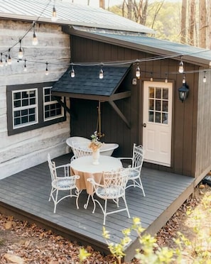 Back patio with string lights and functional soaking tub! (note, tub is operational from April to September)