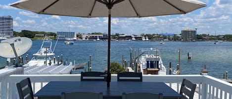 Enjoy lunch on the porch overlooking the harbor and your private boat slip