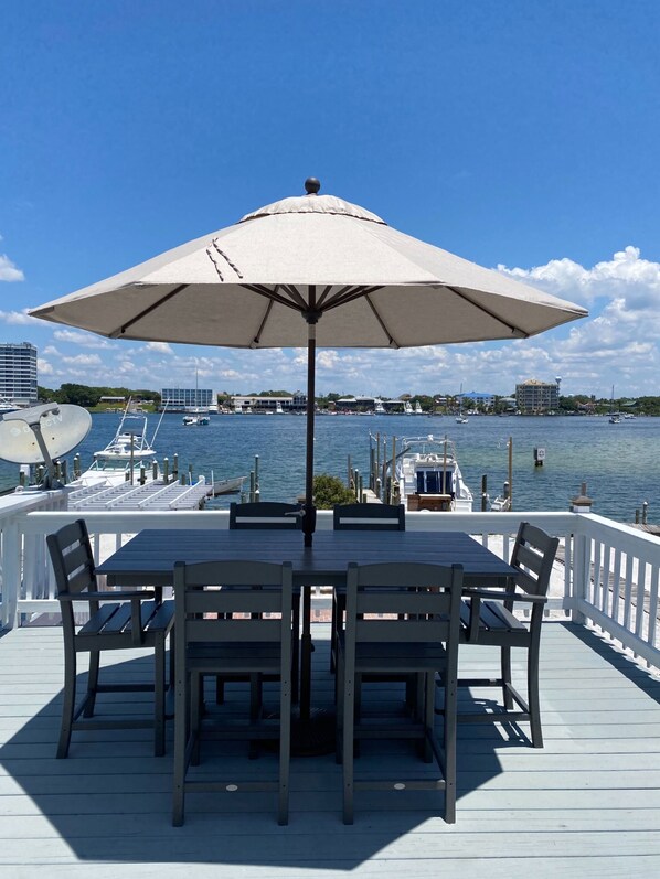 Enjoy lunch on the porch overlooking the harbor and your private boat slip