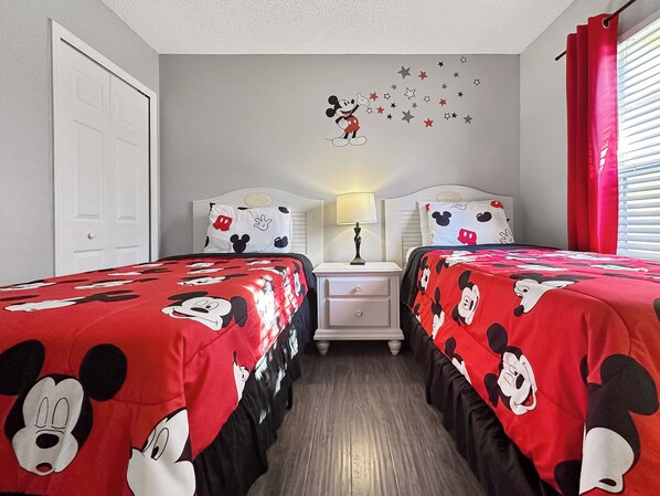 Kids room with TV and closet and dresser