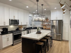 Full Kitchen with microwave, gas stove top and oven 