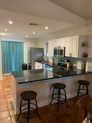 Recently updated modern kitchen. You can see the ocean while making breakfast 