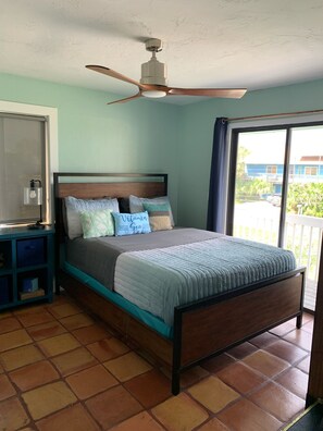 Guest Room 2. Queen bed. Has a entrance to the front balcony. 40 inch TV 
