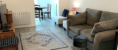 Living room leading to dining area and rear garden