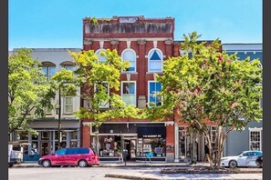 The center of downtown Wilmington on Front St and Market St. Walk everywhere! Views of the Cape Fear River, horse and carriage rides, parades, fireworks, and the Riverwalk, you can watch the hustle and bustle without standing in crowds.