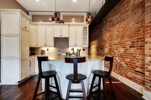 Fully equipped kitchen bar seating area