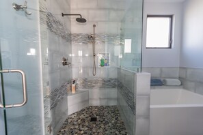 Master bathroom with rain shower, tub and Toto Washlet toilet.