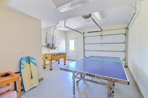 Enjoy the game room with its foosball table, ping-pong table, wet bar, flatscreen TV, and stereo system, with access to the pool and hot tub.