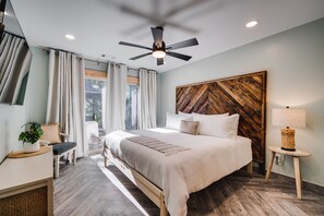 BEDROOM 1: King Bed, conveniently close to Bathroom 1 & Laundry Area, with sliding glass door access to the outdoor area