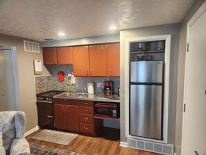 Kitchen with stove and fridge