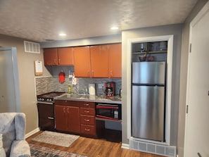 Kitchen with stove and fridge