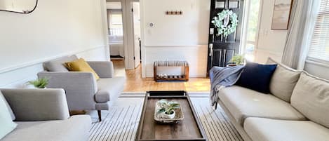 Cozy living room awaits you as you enter the home.