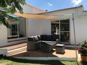 Corner suite with sun sail for shade.