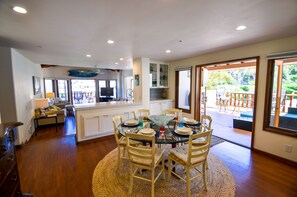 View from kitchen looking into dining areas and living room