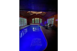 Indoor salt water heated pool & hot tub.  Pool room door has locks and an alarm
