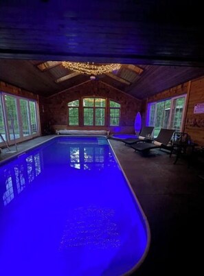 Indoor salt water heated pool & hot tub.  Pool room door has locks and an alarm
