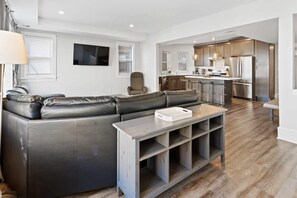 Living room w/large leather sectional overlooking the Boardwalk & Ocean