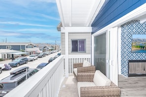 Sliding doors open out to the front deck to welcome in the ocean breeze.