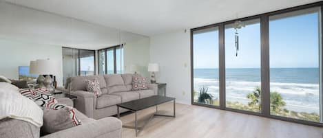 Windows Galore - The large, elegant windows allow the living room to be filled with lots of natural lighting.