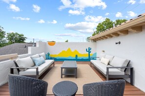 Rooftop patio with custom Casa Amigos mural