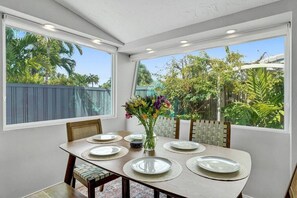 Dining room filled with sunlight and a nice view