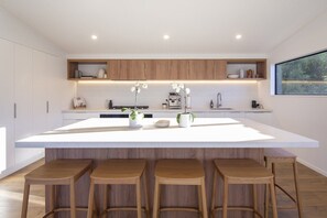 Modern kitchen island with bar stools