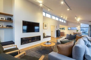 Lounge area with TV and fireplace