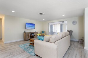 Living room with queen sofa sleeper and flatscreen TV for streaming all your favorite apps