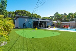 Escape to your own backyard oasis, where every putt feels like a mini vacation.