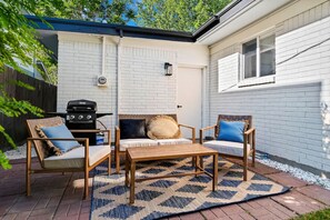 Outdoor living area with a grill