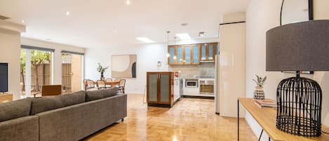 Open plan living, dining, kitchen leading out to north facing courtyard 