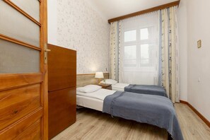 Two comfortable single beds in the bedroom. 