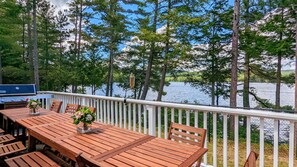 ample seating on deck overlooking lake