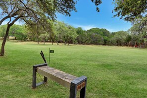 The property features a golf green with tee boxes at 25, 50. 75 and 100 yards.