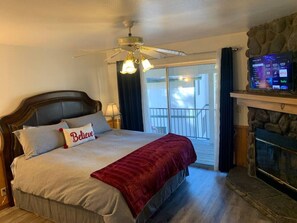 Cozy Master Bedroom with Smart TV and a fire place to keep you warm