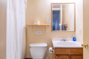 Well tiled bathroom and shower area