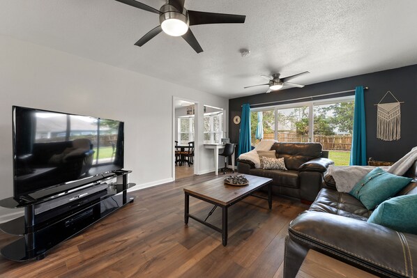 Living room - Enjoy and watch the kids play outside from the comfort of this relaxing living room.