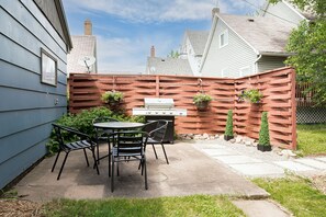 The outdoor patio is perfect for entertaining and cooking on the gas grill.