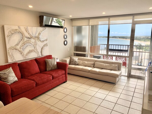 Queen sofa sleeper in living room & Direct Beach Views